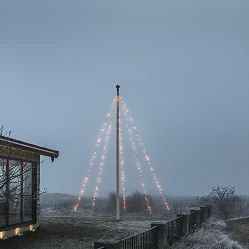 Konstsmide LED Fahnenmastbeleuchtung mit Ring, 5 Stränge à 100 gefrostete Dioden, mit Bodenfeder und-anker, 500 bernsteinfarbene Dioden, 24V Außentrafo (IP44), 9W, schwarzes Soft-Kabel - 4781-837 von Konstsmide